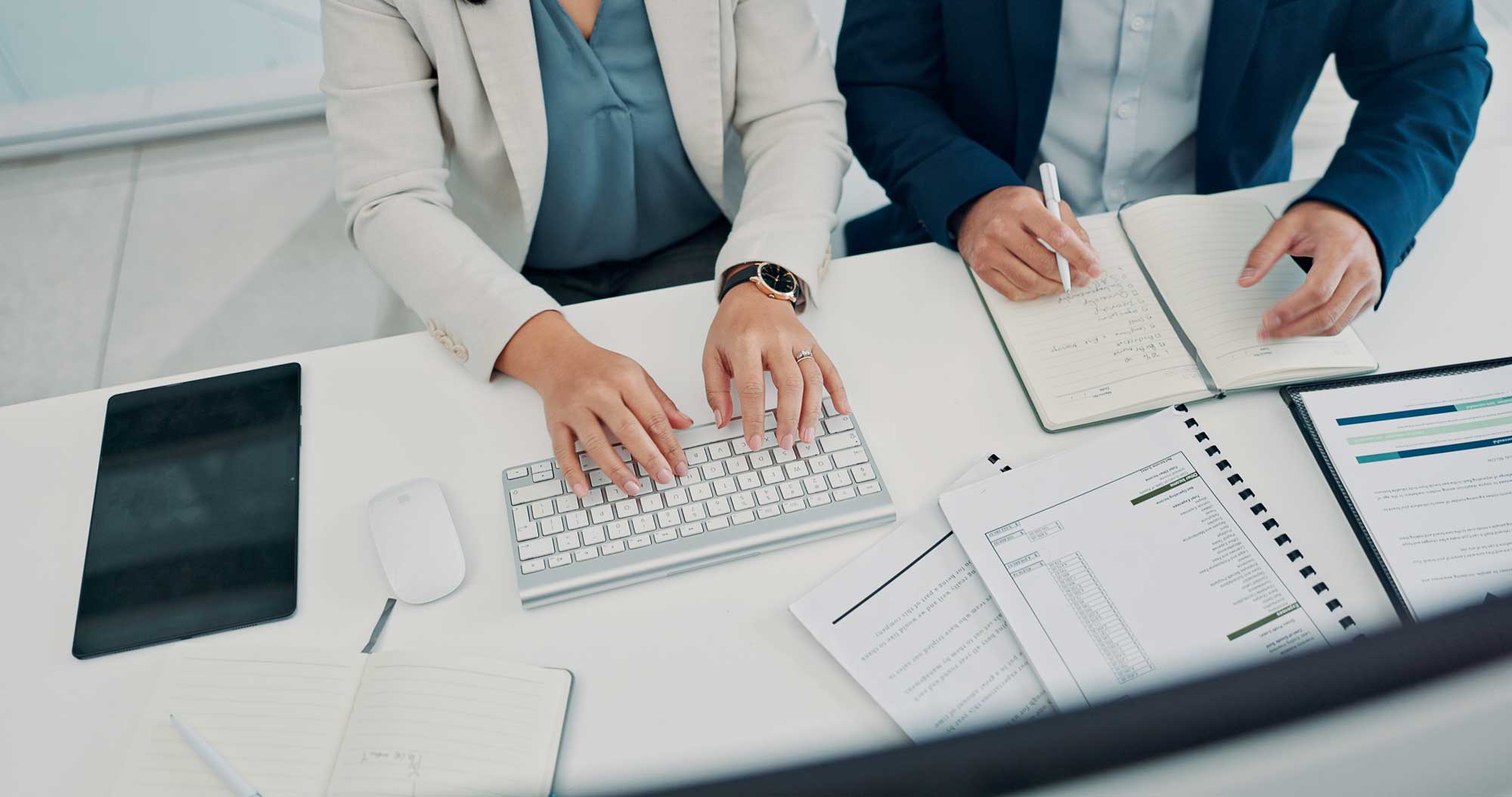 professional_looking_at_document_using_calculator
